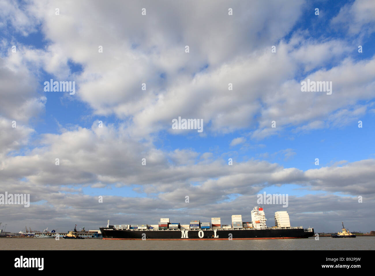 united kingdom kent gravesend a fully laden container ship travelling up the river thames to tilbury docks Stock Photo