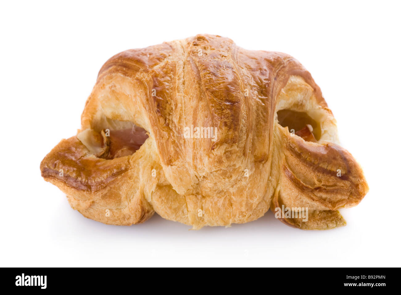 Croissant stuffed with ham and melted cheese isolated on white Stock Photo