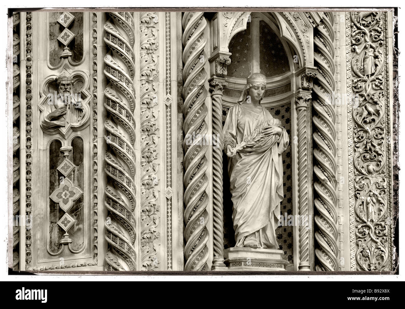 Statue Of Saint Mary Of The Flowers on the facade of Florence Duomo (Cattedrale di Santa Maria del Fiore , Florence Italy Stock Photo