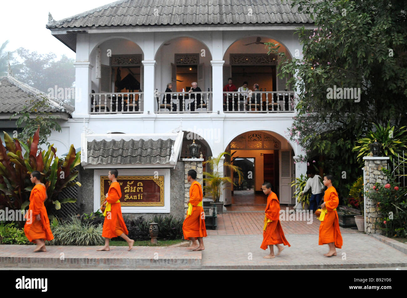 Monks collect alms Stock Photo