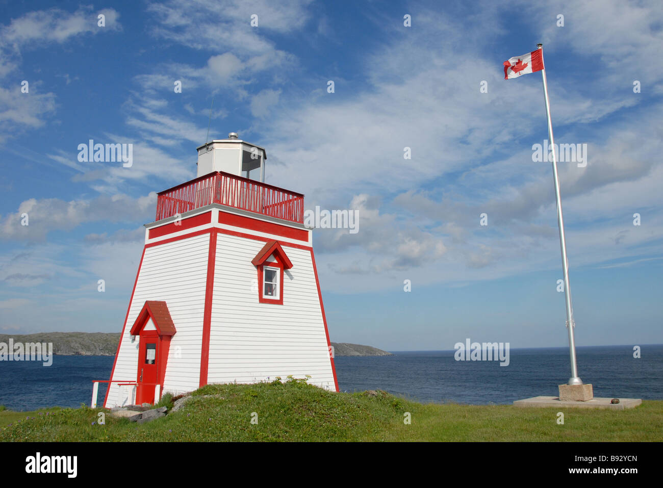 Lighthouse and Canadian Flag St Anthony Newfoundland Canada Stock Photo