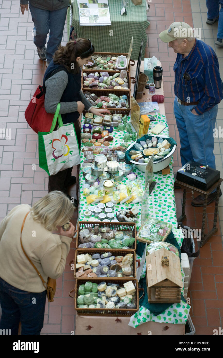 Women sampling home made soaps at Farmers Market every Saturday year round in Troy New York Stock Photo