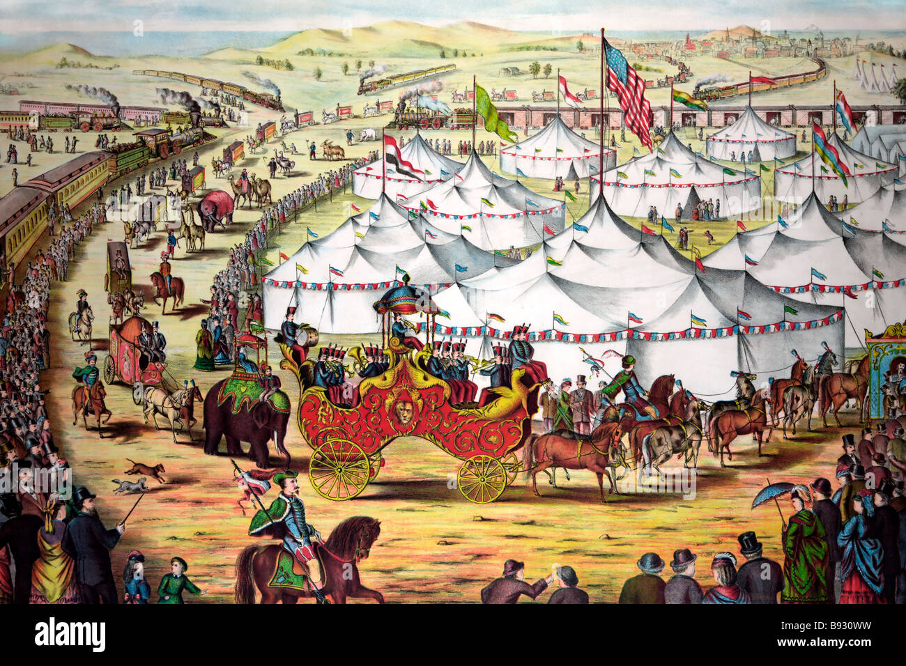 The grand lay-out - Circus parade around tents, with crowd watching alongside railroad train. Stock Photo