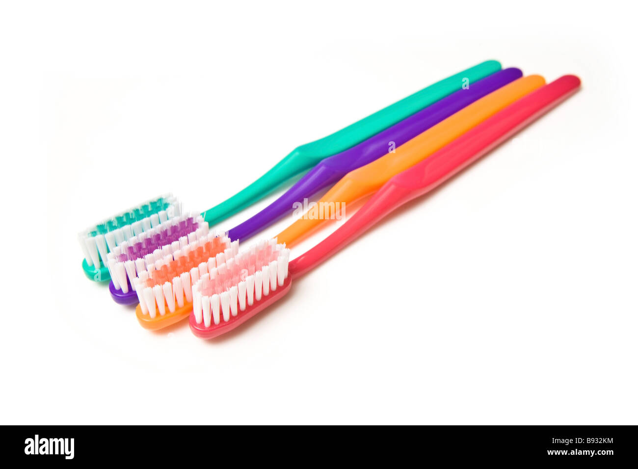 Colored toothbrushes isolated on a white studio background Stock Photo