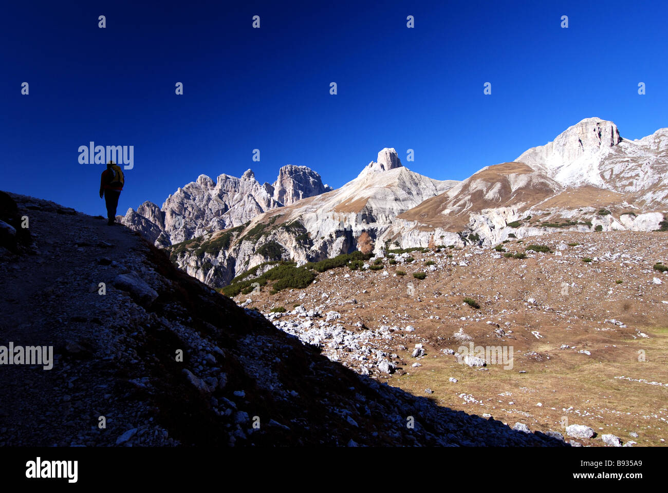 Hiker on trail around Tre Cime di Lavaredo, Dolomites, Italylotscher Stock Photo