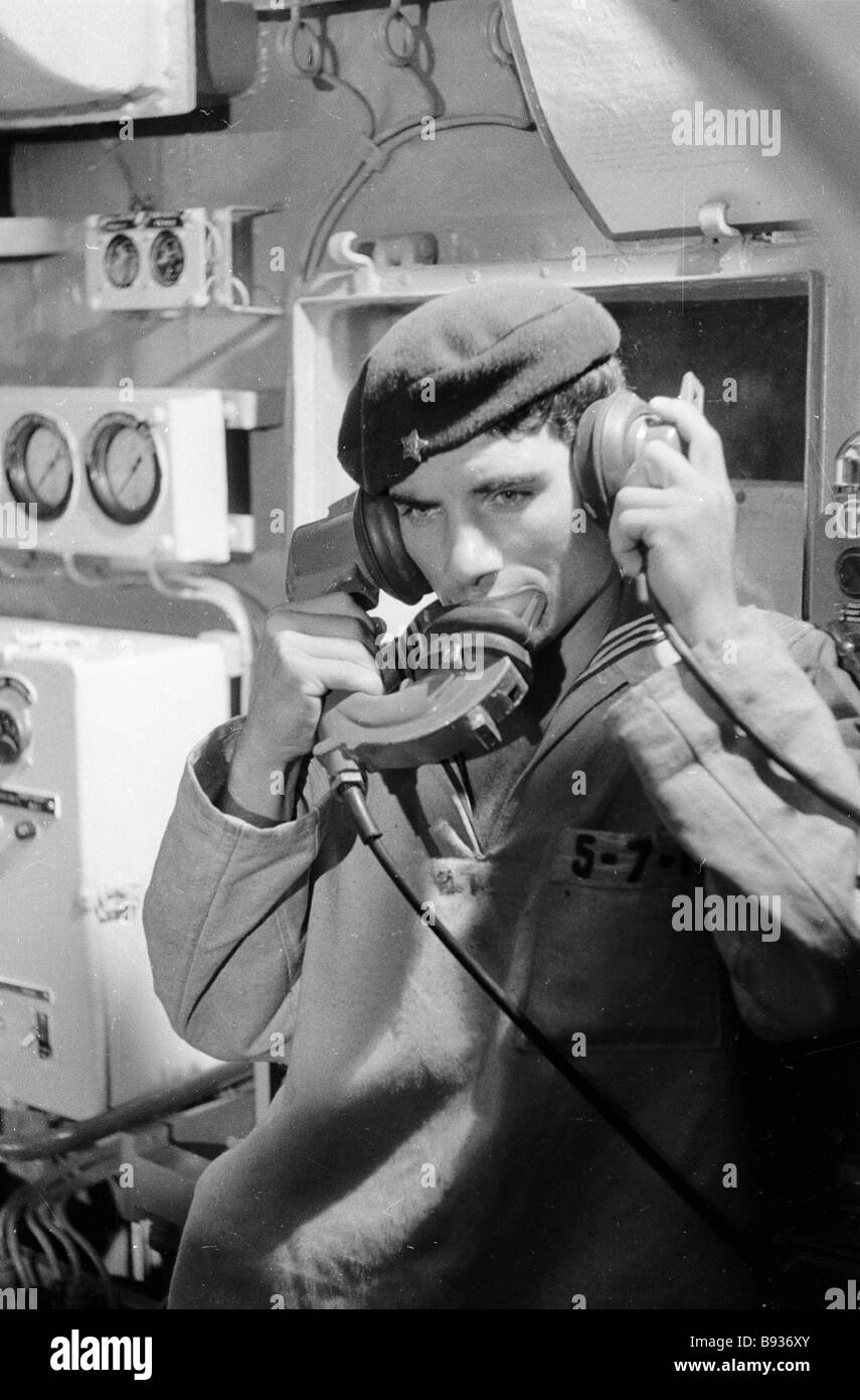 A sailor in the conning tower of the cruiser Moskva is speaking by