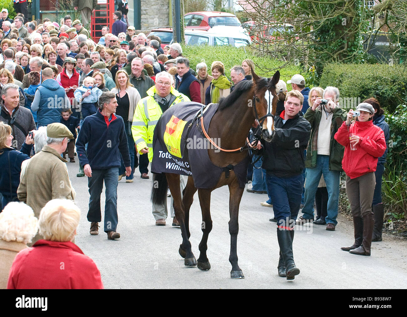 'Kauto Star' winner of the 2009 Cheltenham Gold Cup with stable lad Nick Child being paraded through Ditcheat Stock Photo