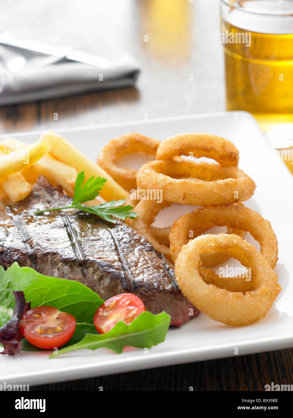 steak, chips and onion rings Stock Photo Alamy
