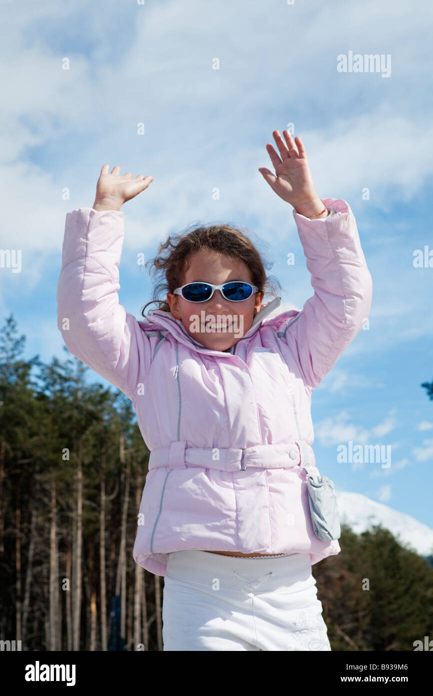 Happy child jumping in the sky in the alps Stock Photo - Alamy