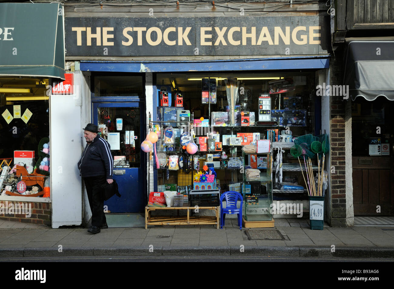 Man leaving The Stock Exchange A Petersfield shop selling a variety of