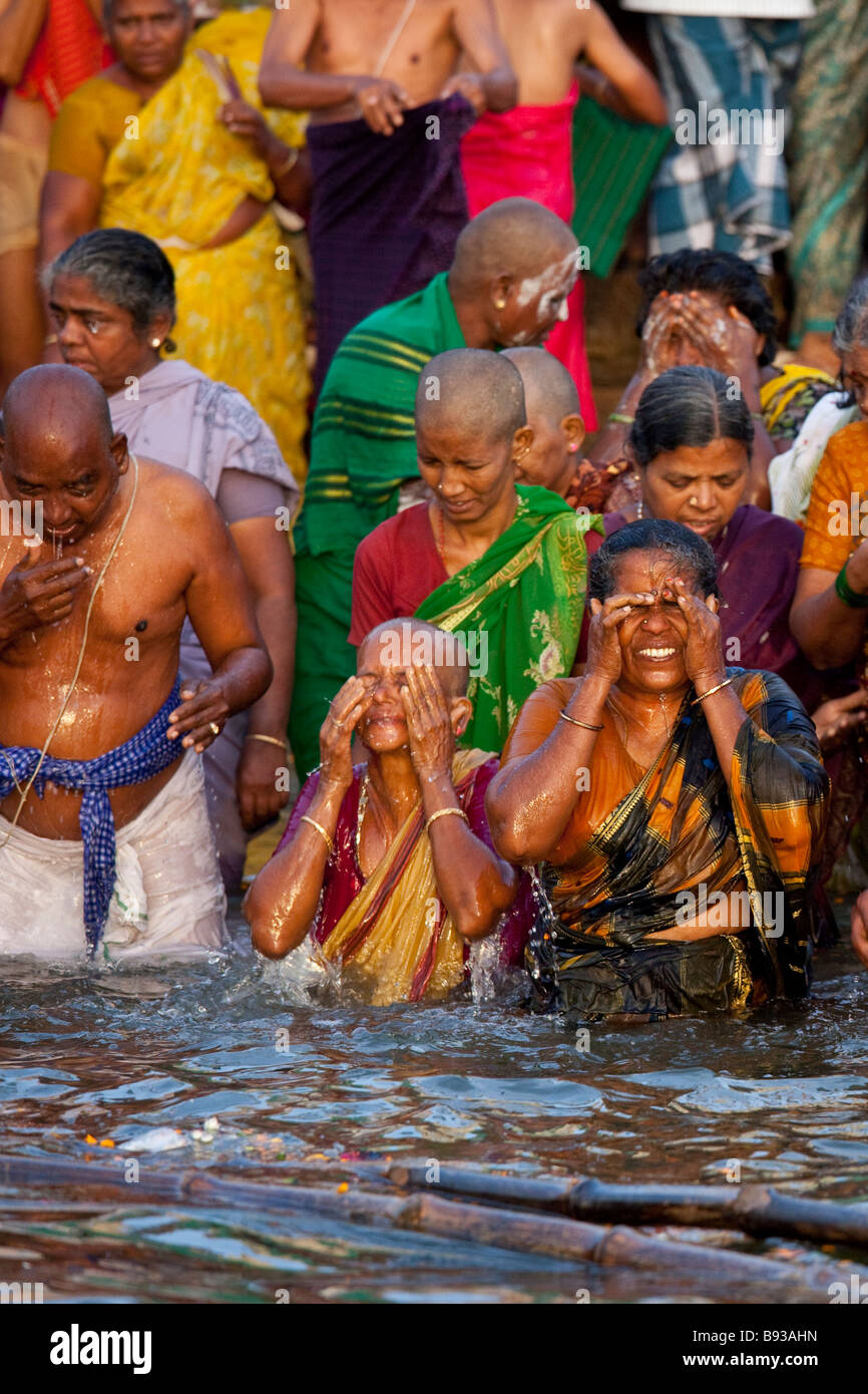 Hindu People Bathing in the Ganges River in Varanasi India Stock Photo