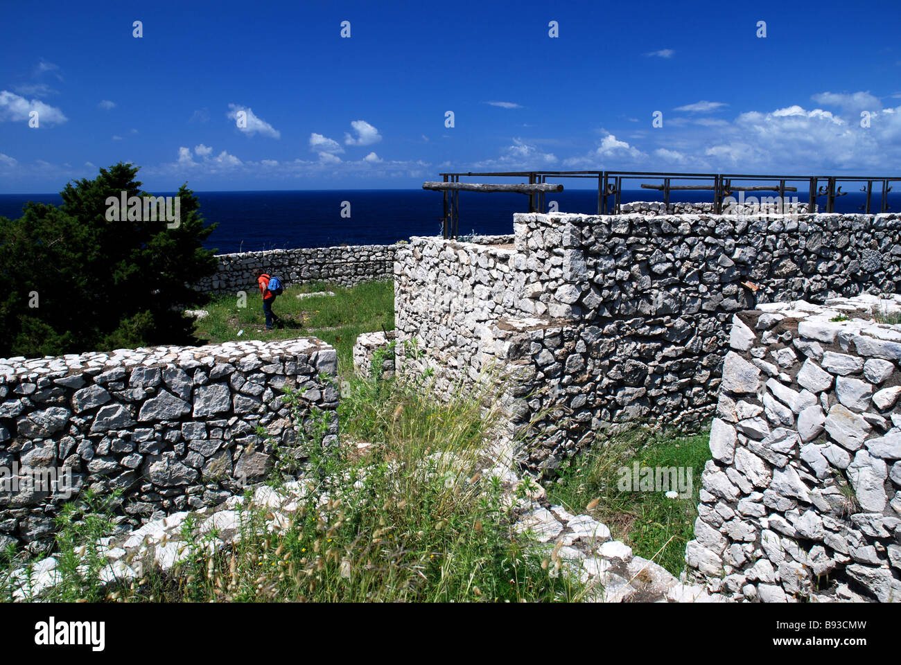 Hiker at Fortino del Pino historical site estcoast Island Capri Campania Italy Model released Stock Photo