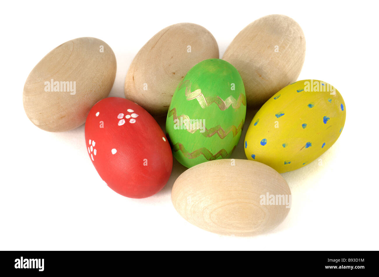Easter wooden eggs on a white background Stock Photo - Alamy