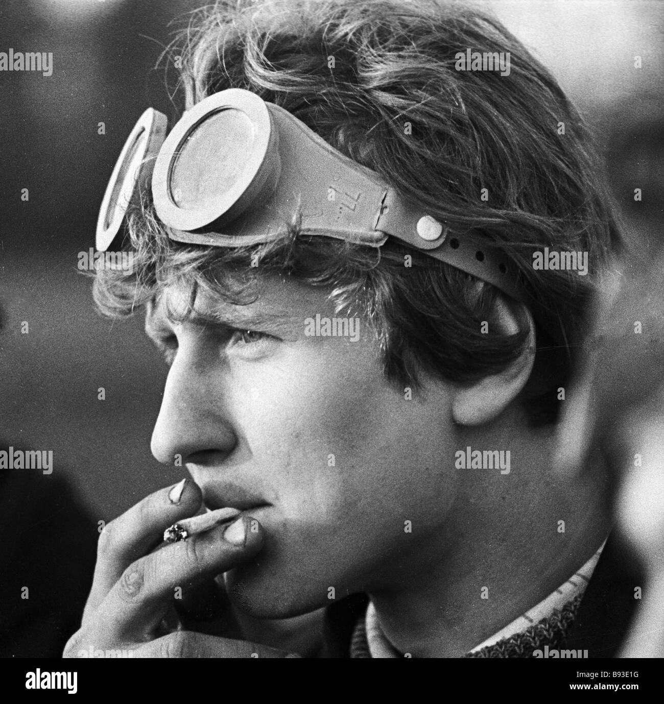 Smoking Grad Student A graduate of a combine operators school smoking a cigarette Stock ...