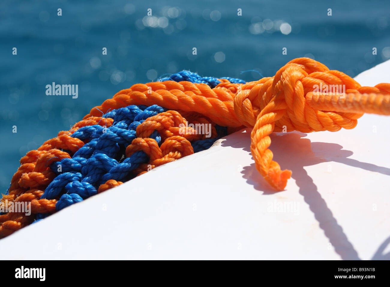 Ropework fender on dive boat Stock Photo