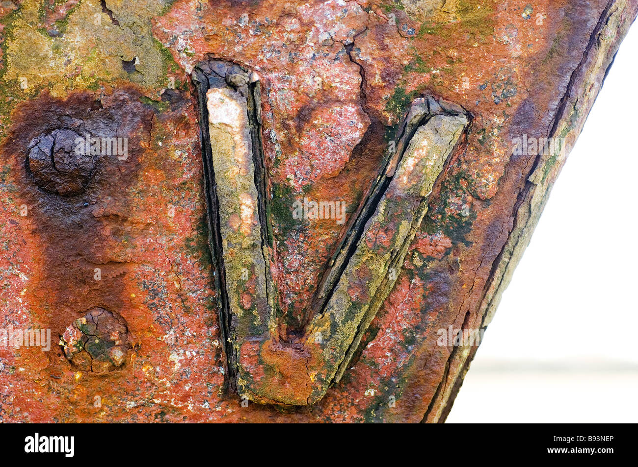 Rusting roman numerals on bow of abandoned fishing boat,Fleetwood,Lancashire,UK Stock Photo
