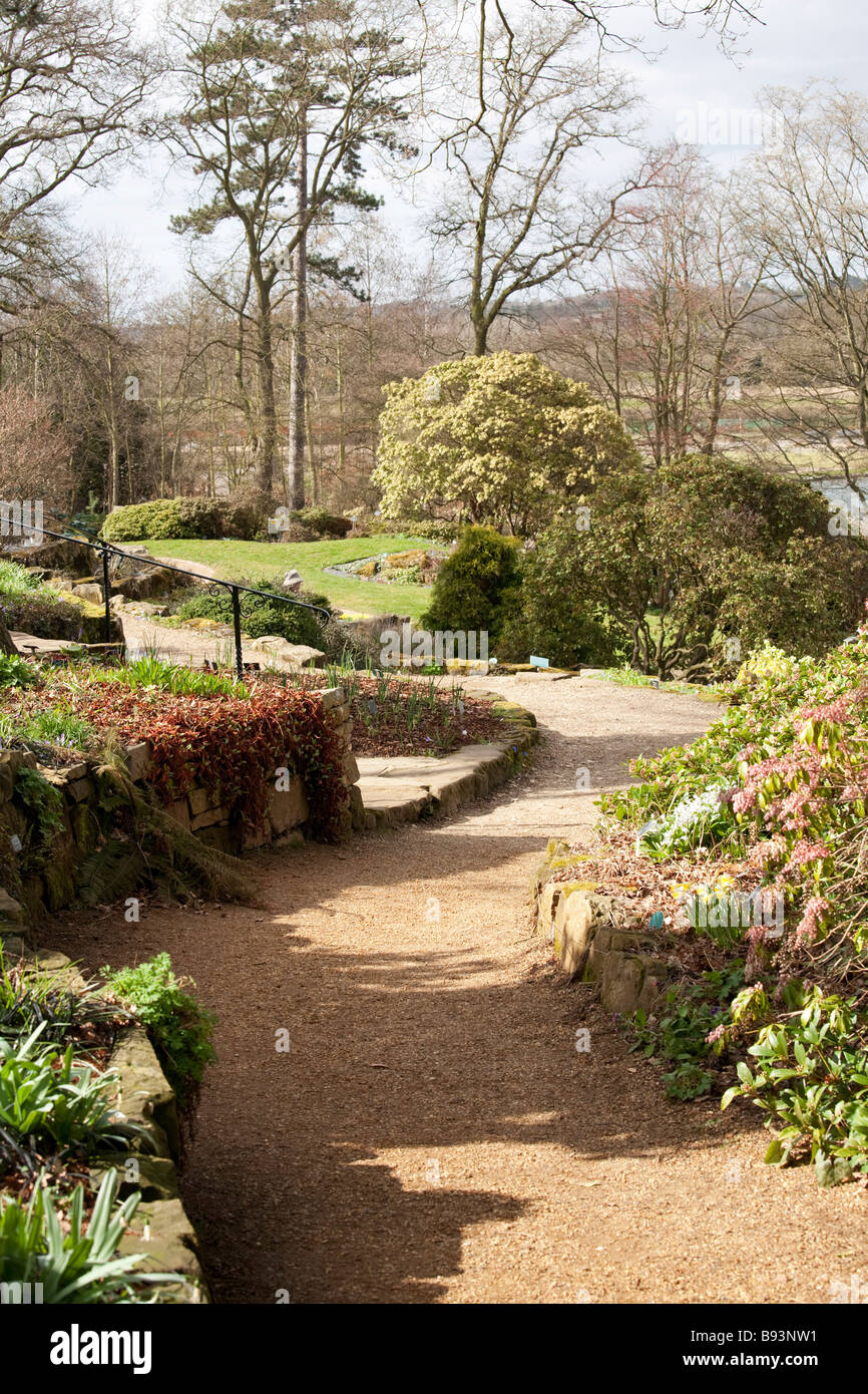 winding footpath through flower beds Stock Photo