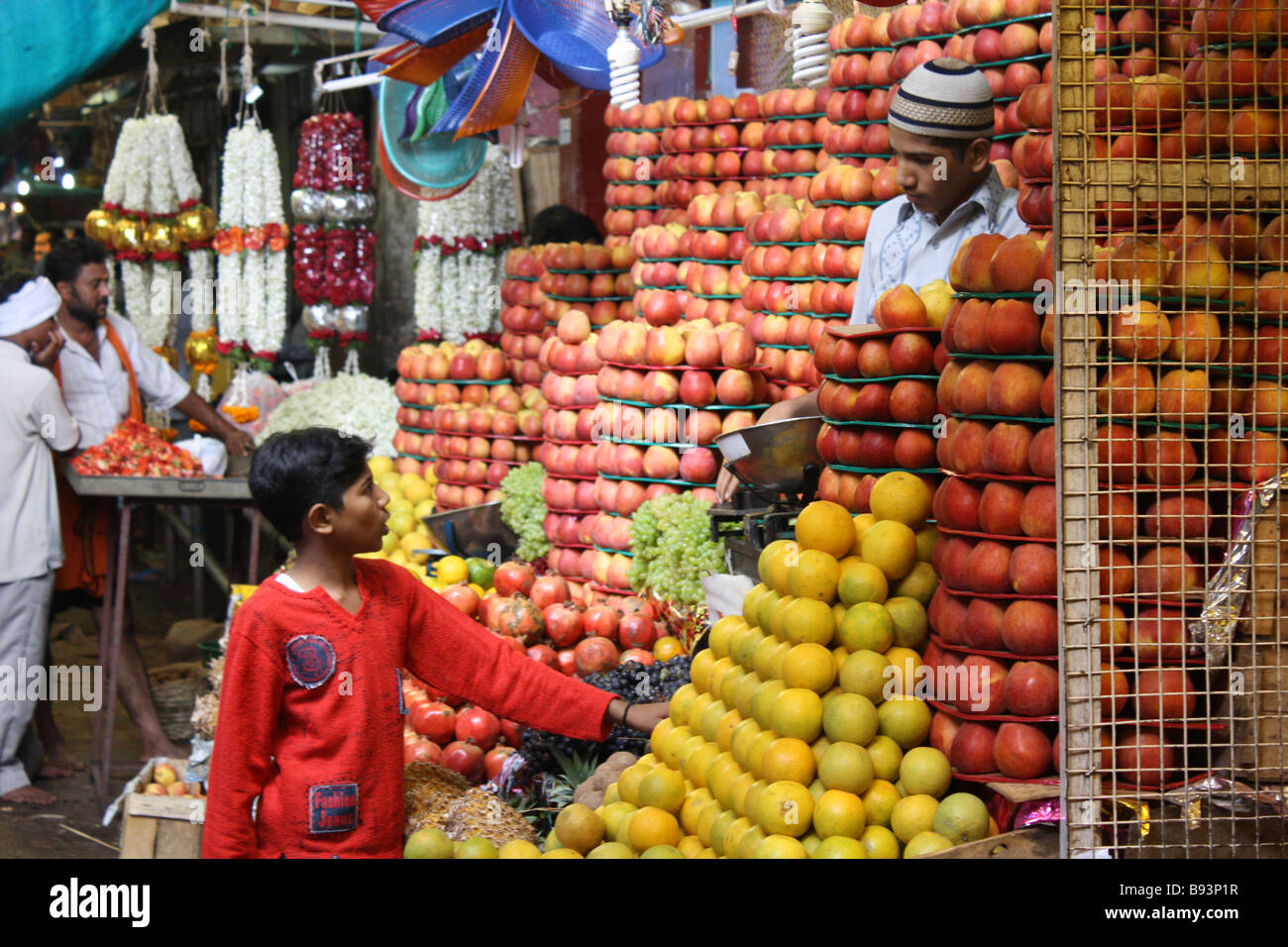 Local boy buying fruit at market in Mysore, India Stock Photo - Alamy