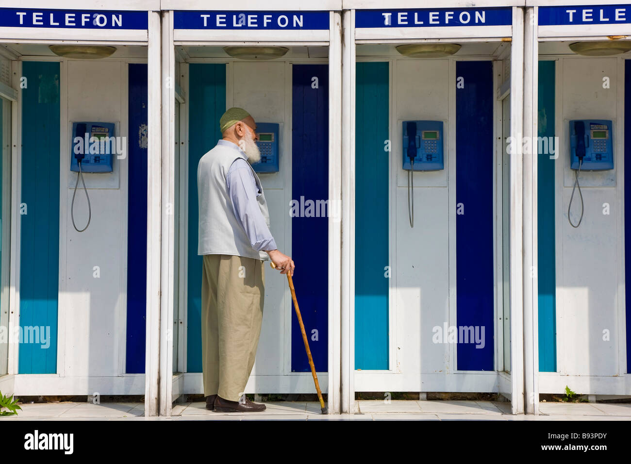 Muslim man in phone box Istanbul Turkey Stock Photo