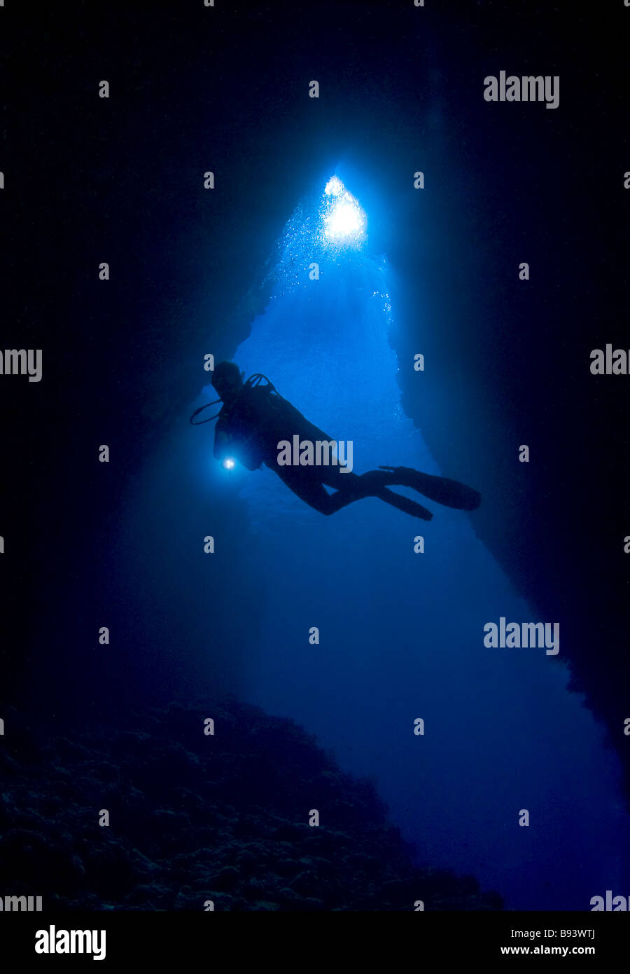 Diver in famous Leru Cut Cave Russell Islands Solomon Islands Stock Photo