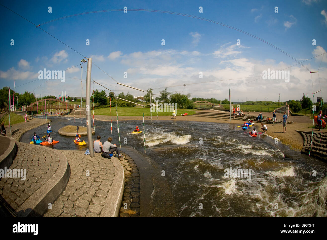 Wide angle shot of kayak training at Tees Barrage International White Water Centre on the River Tees on a sunny UK day. Stock Photo
