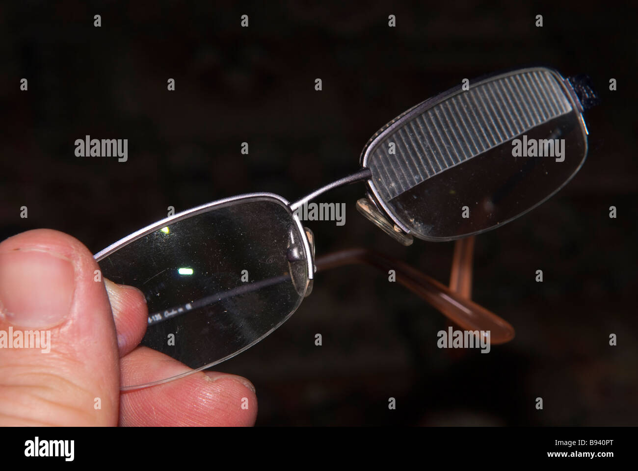 A close up of a pair of spectacles fitted with a prism to try and correct 6th nerve palsy (double vision) Stock Photo