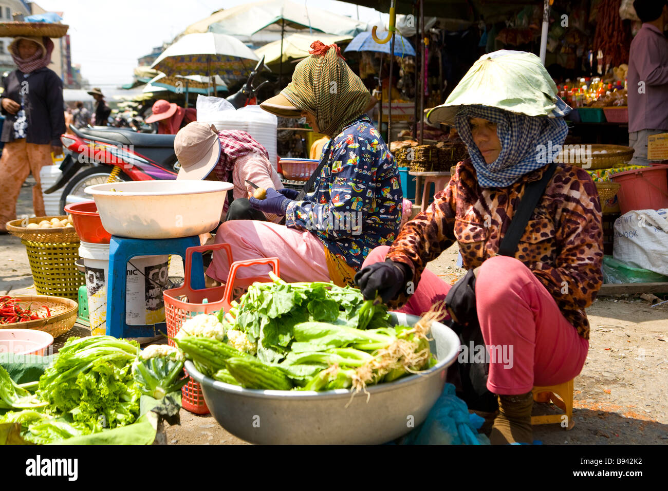 Women vendors in a Cambodian marketplace photographed in Phnom Penh