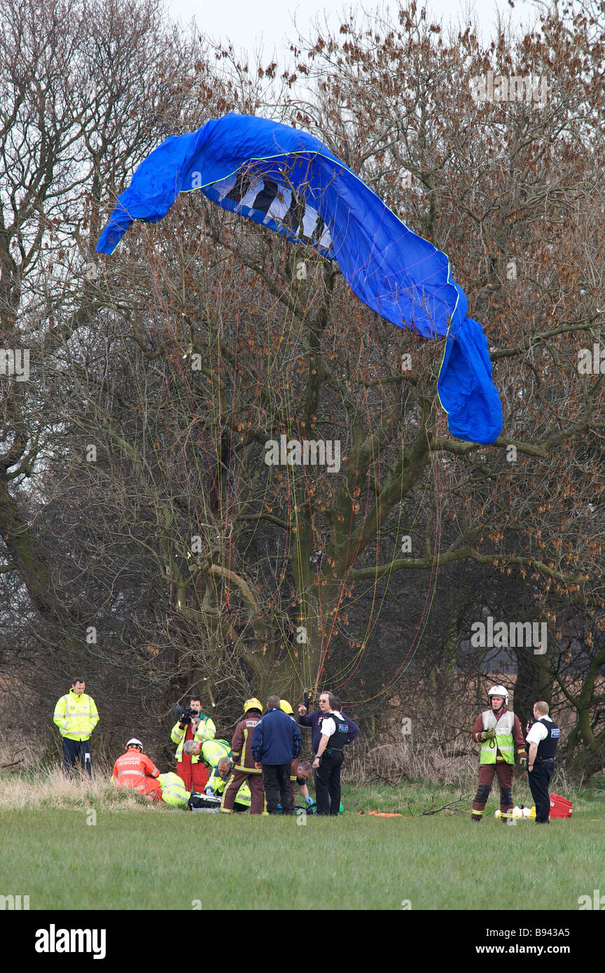 Paramedics and members of South Yorkshire Fire and Rescue attend the scene of a paramotor
