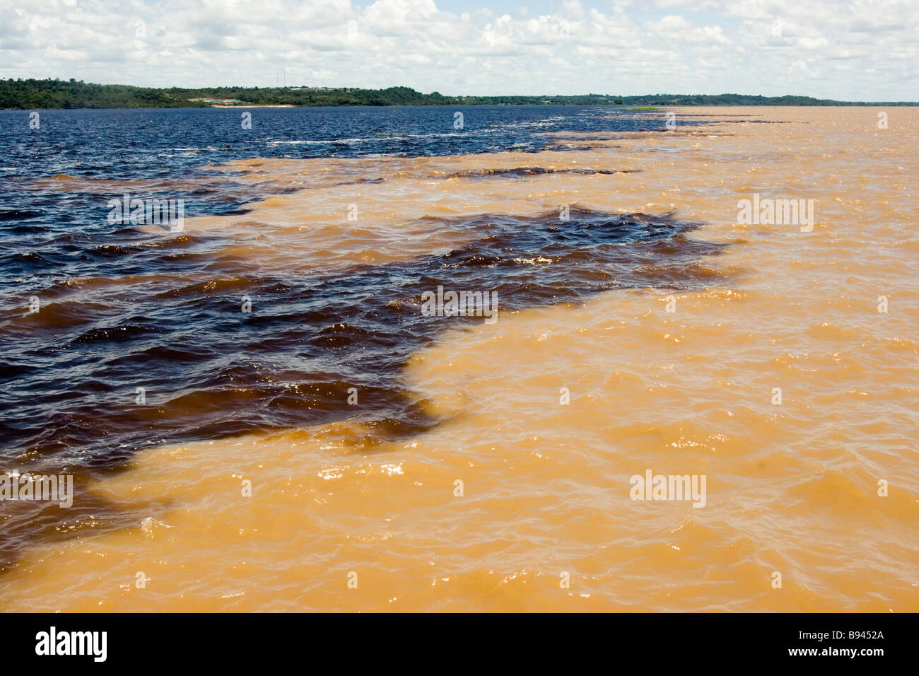 Meeting of the waters confluence of the yellow brown Rio Solimoes and ...
