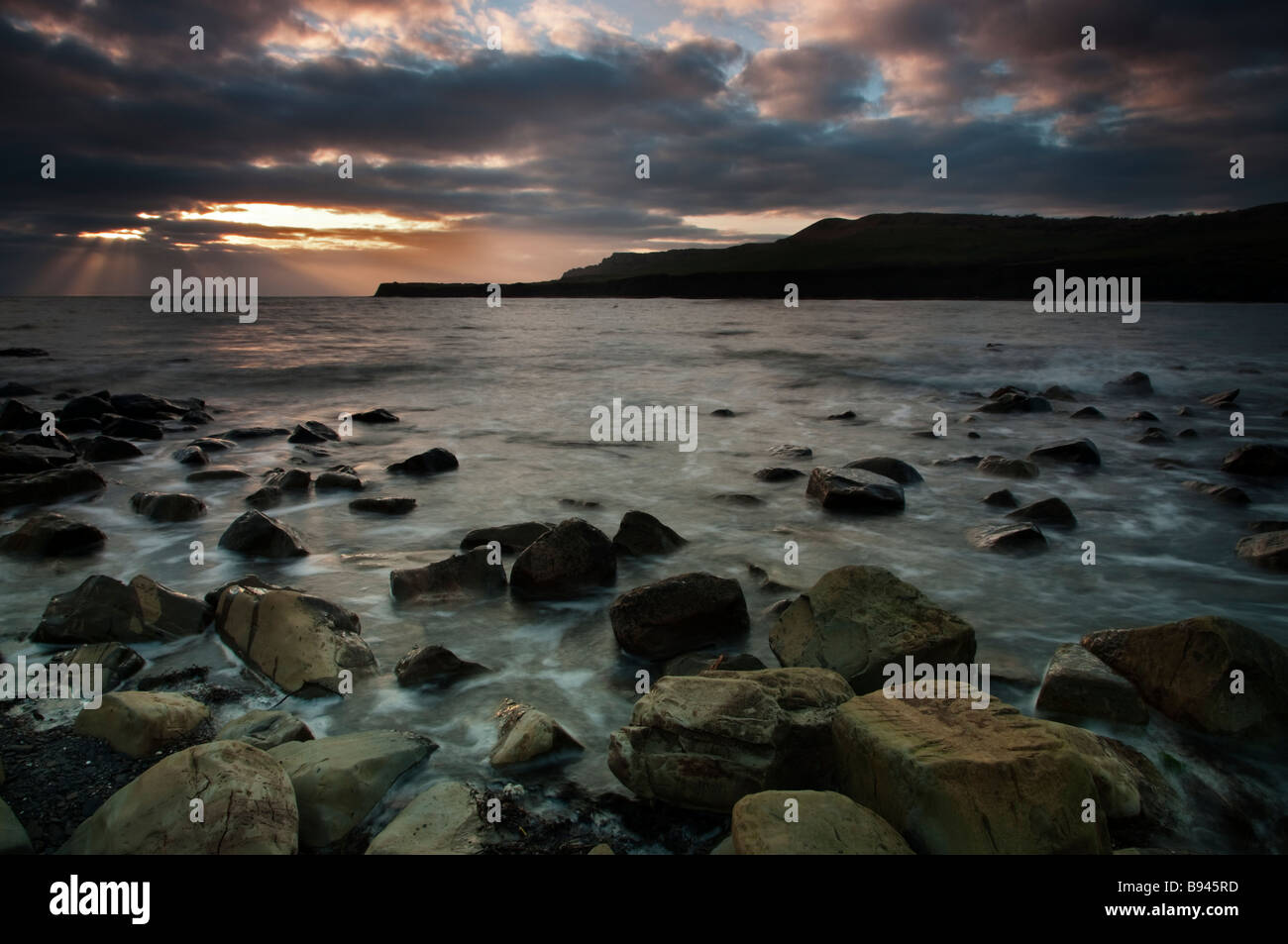 Kimmeridge bay winter sunset Nearby Weymouth is due to be a venue for the upcoming London 2012 Olympics Stock Photo