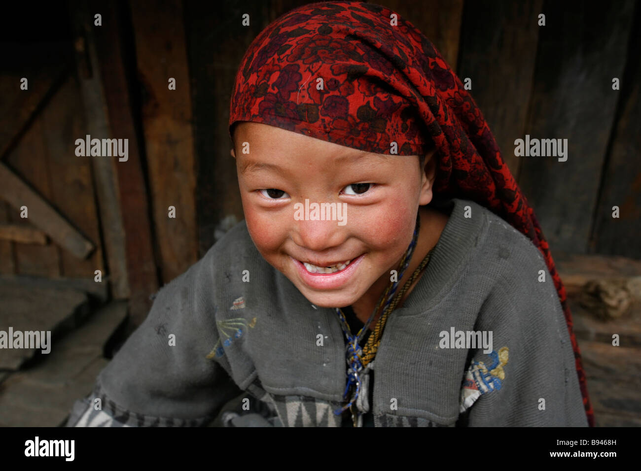 Annapurna Nepal 20 March 2008 Portrait of young Nepali girl smiling at trekkers on the trail Stock Photo