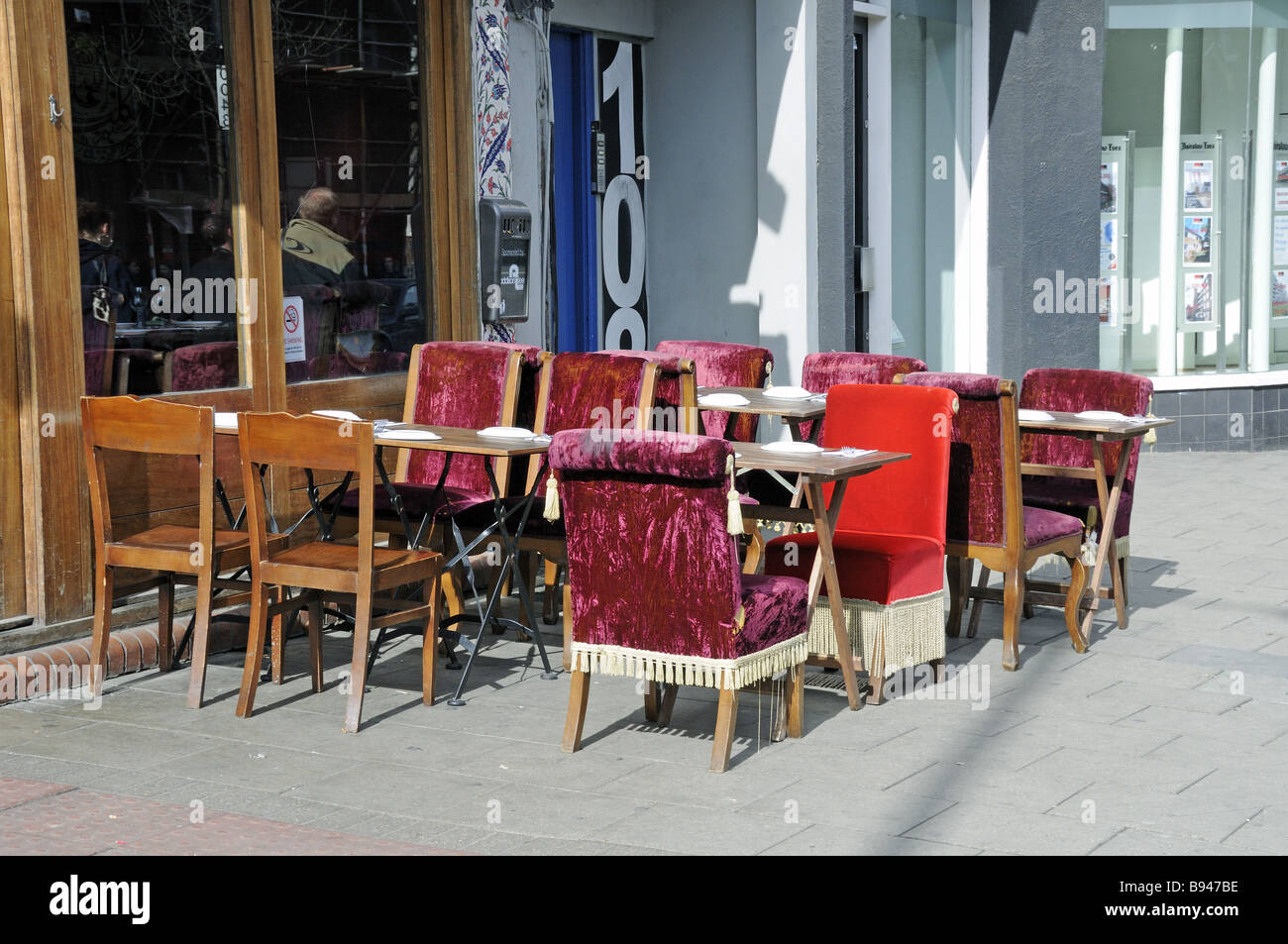 Opulent seating awaiting diners outside Gallipoli Restaurant Upper Street Islington London England UK Stock Photo