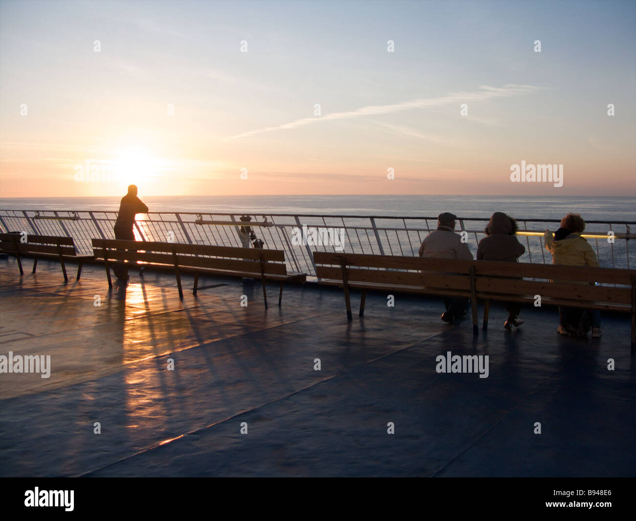 People enjoying the sunset from the rear viewing platform of the Oscar ...
