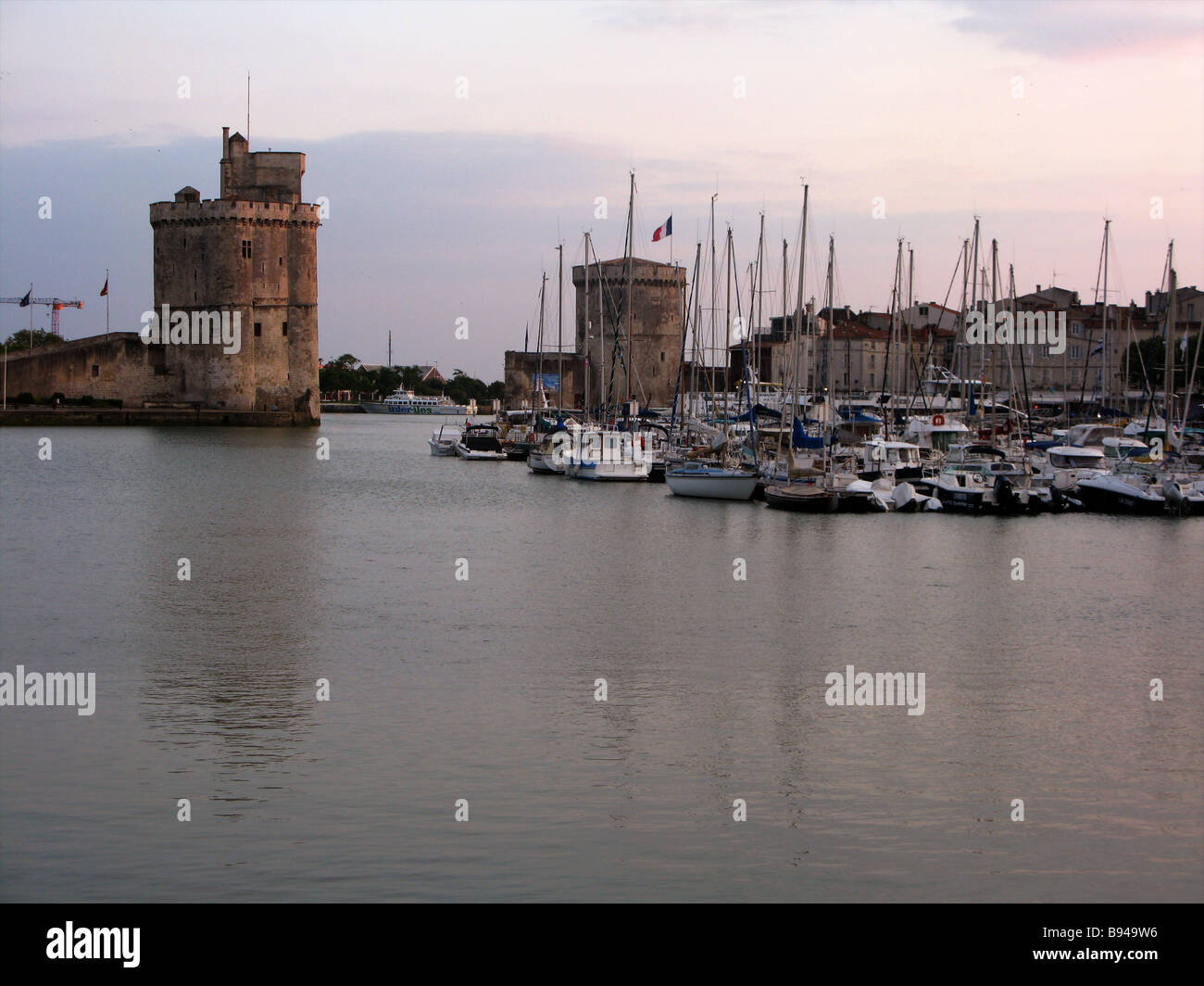 The picturesque village seaside village of La Rochelle France with the lighthouse at sunset Stock Photo