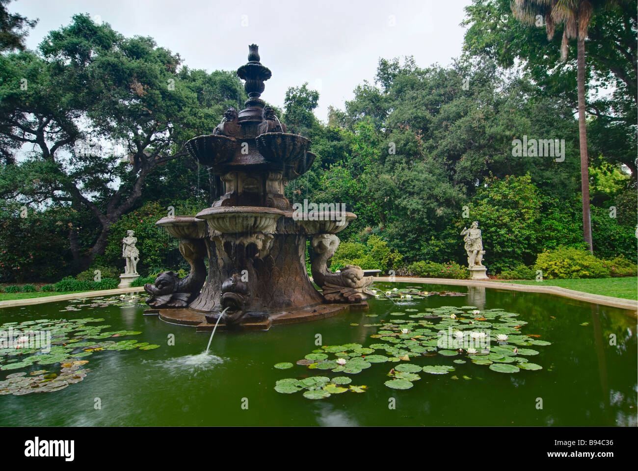 Large Fountain with water lilies and Sculptures surrounding it. Stock Photo