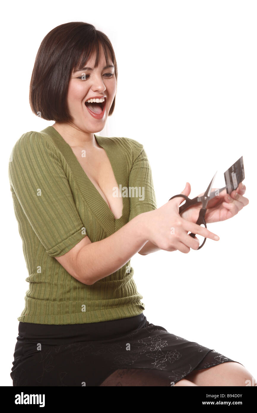Woman cutting credit card Stock Photo Alamy