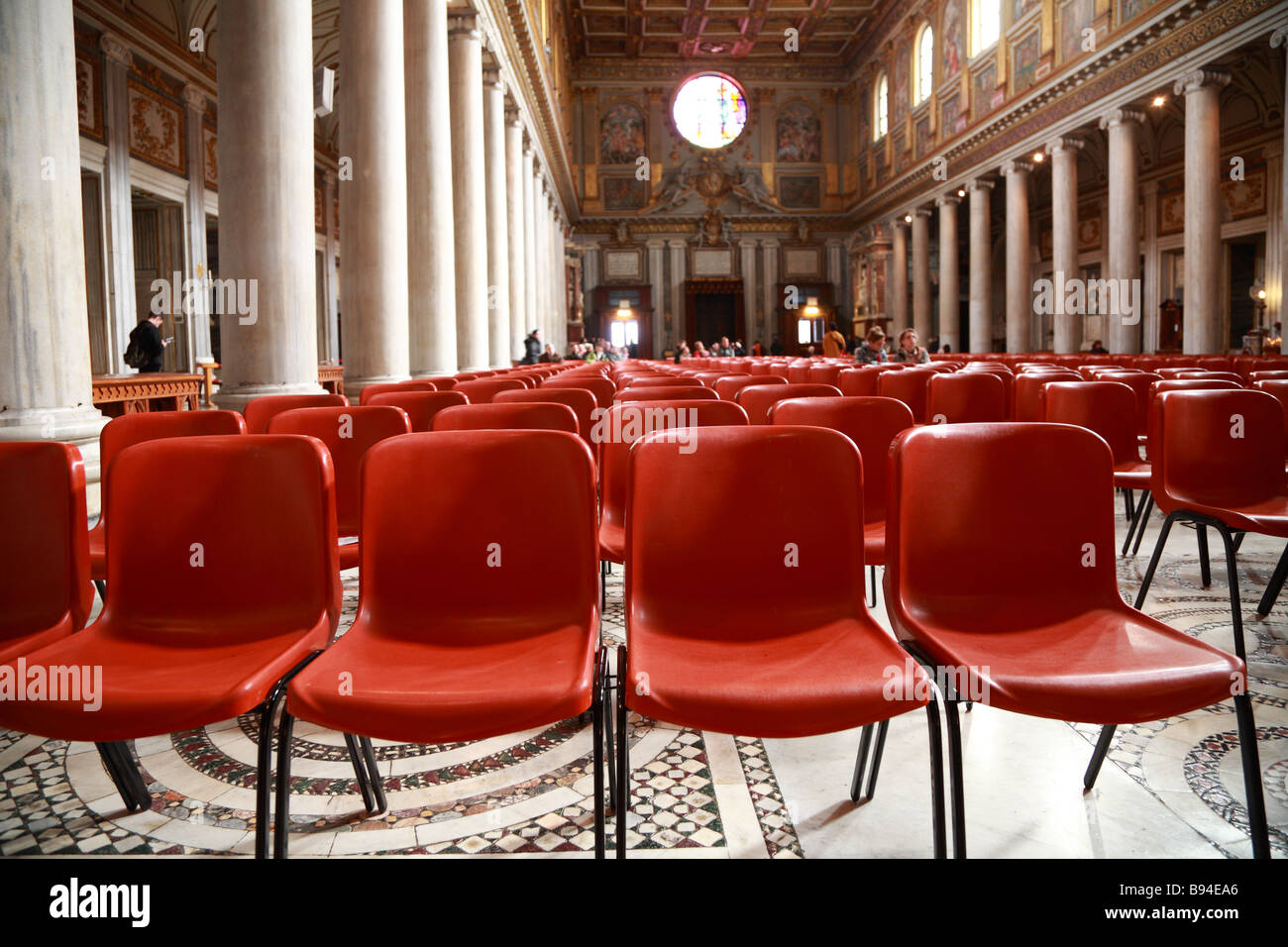 Row Of Red Plastic Chairs In The Church Of Saint Mary Major Santa