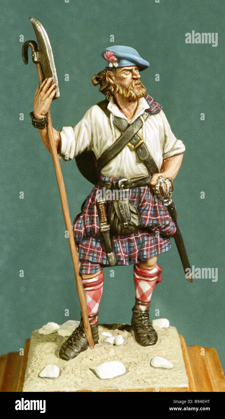 A painted tin figurine of a 17h century Scottish highlander from