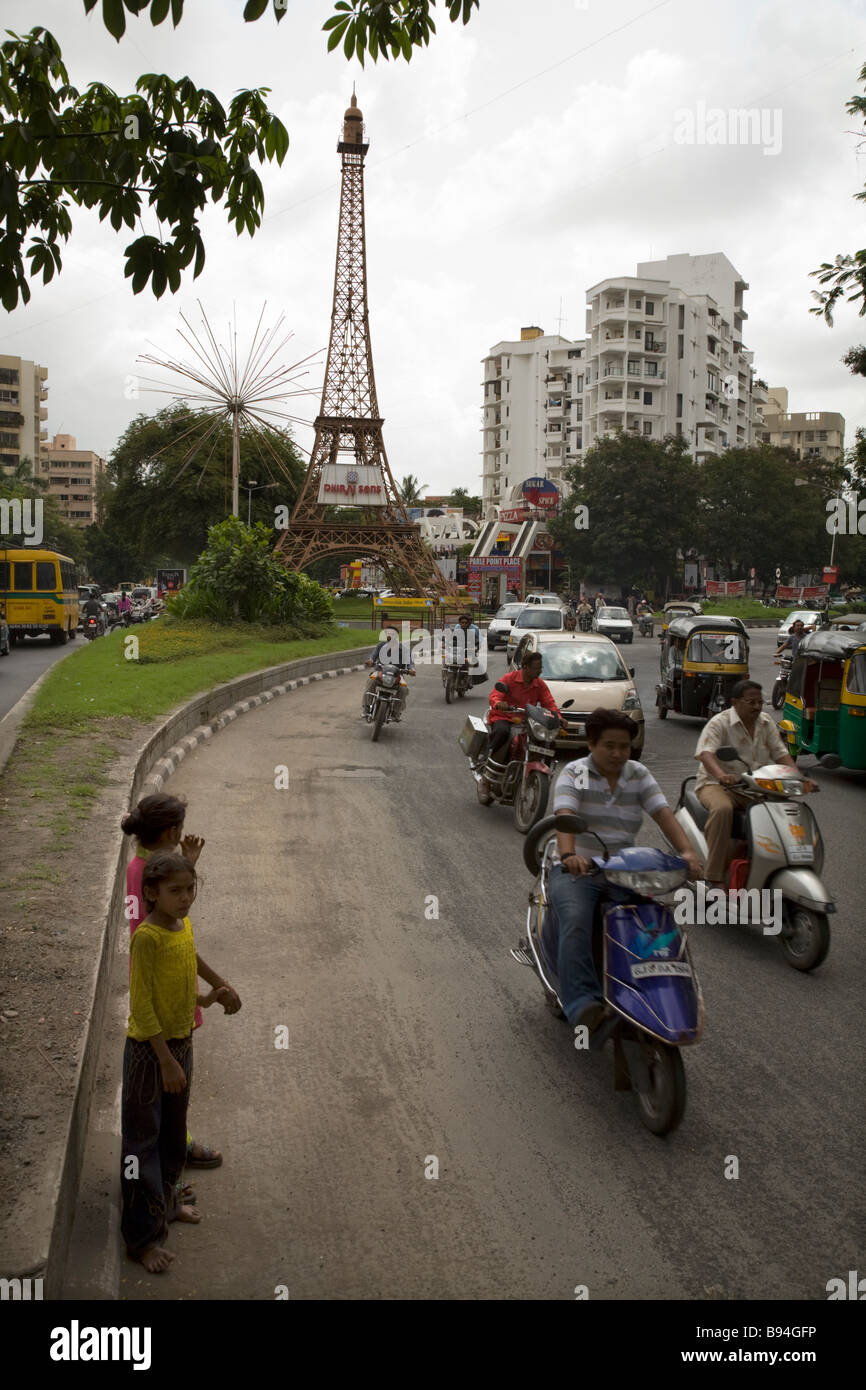 Indian children wait to cross the road near Parle Point roundabout in
