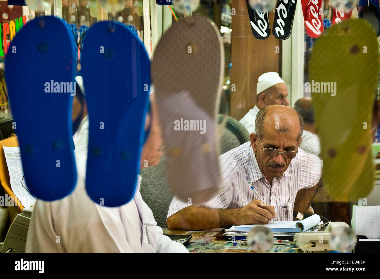 Seller of shoes Deira Dubai United Arab Emirates Stock Photo Alamy