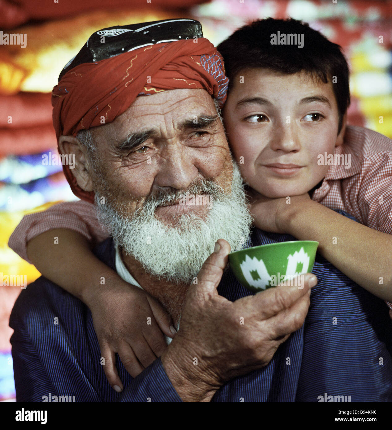 An old Uzbek with his grandson Stock Photo - Alamy