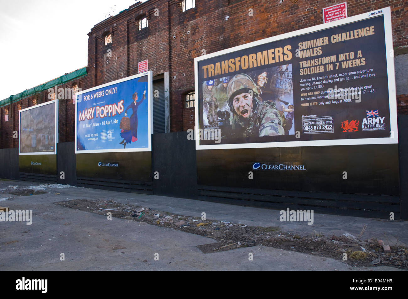 Advertising billboards on derelict building in Newport South Wales UK Stock Photo