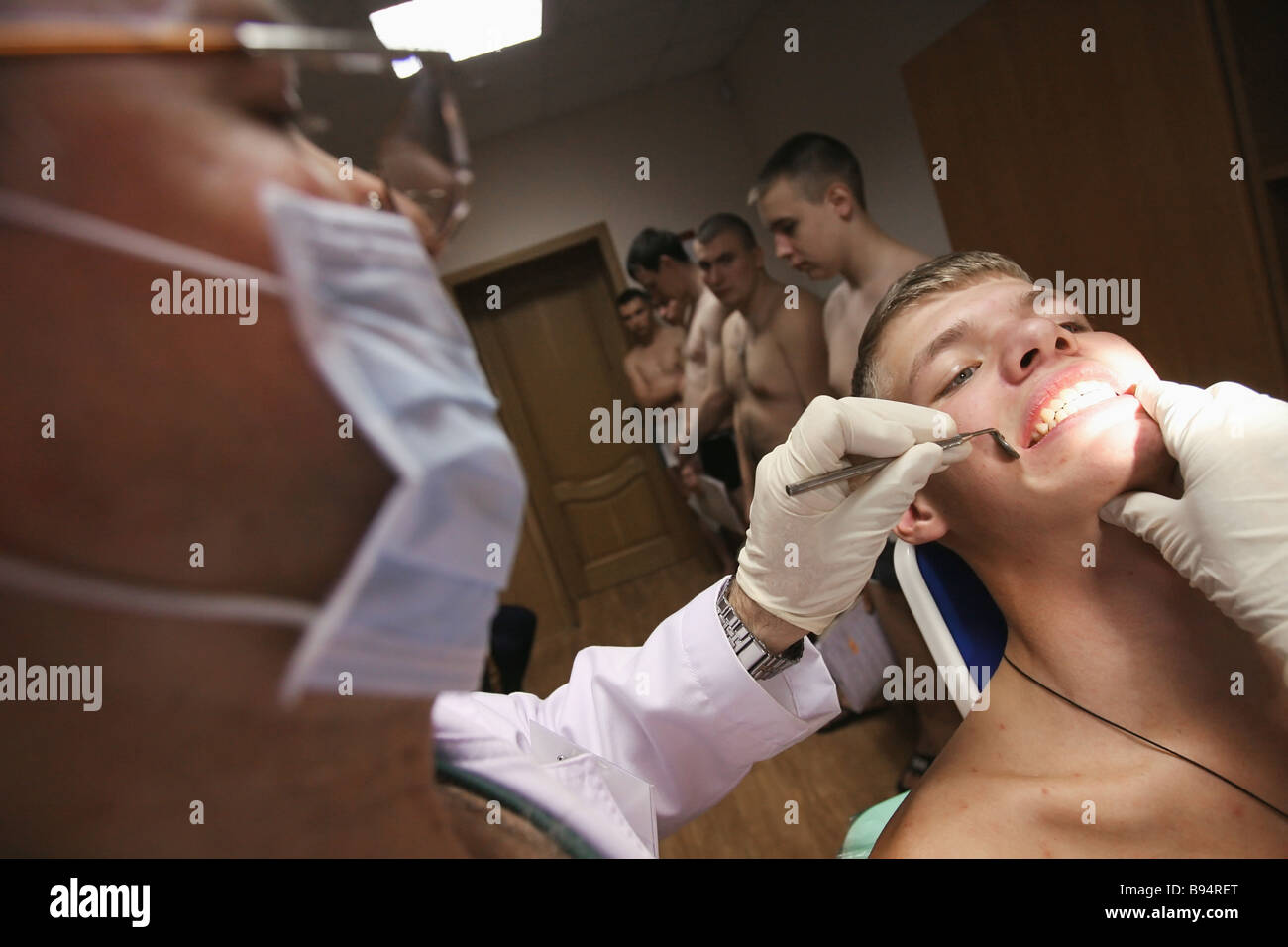 An army conscript undergoes medical examination in a regional assembly ...