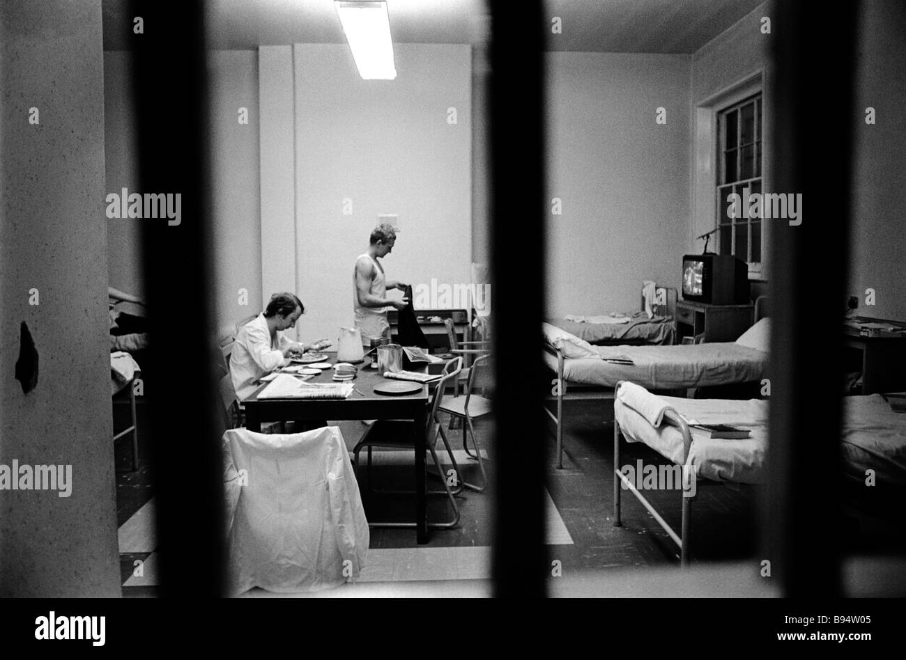 Prisoners seen through the bars of their cell Pentonville Prison London England Stock Photo