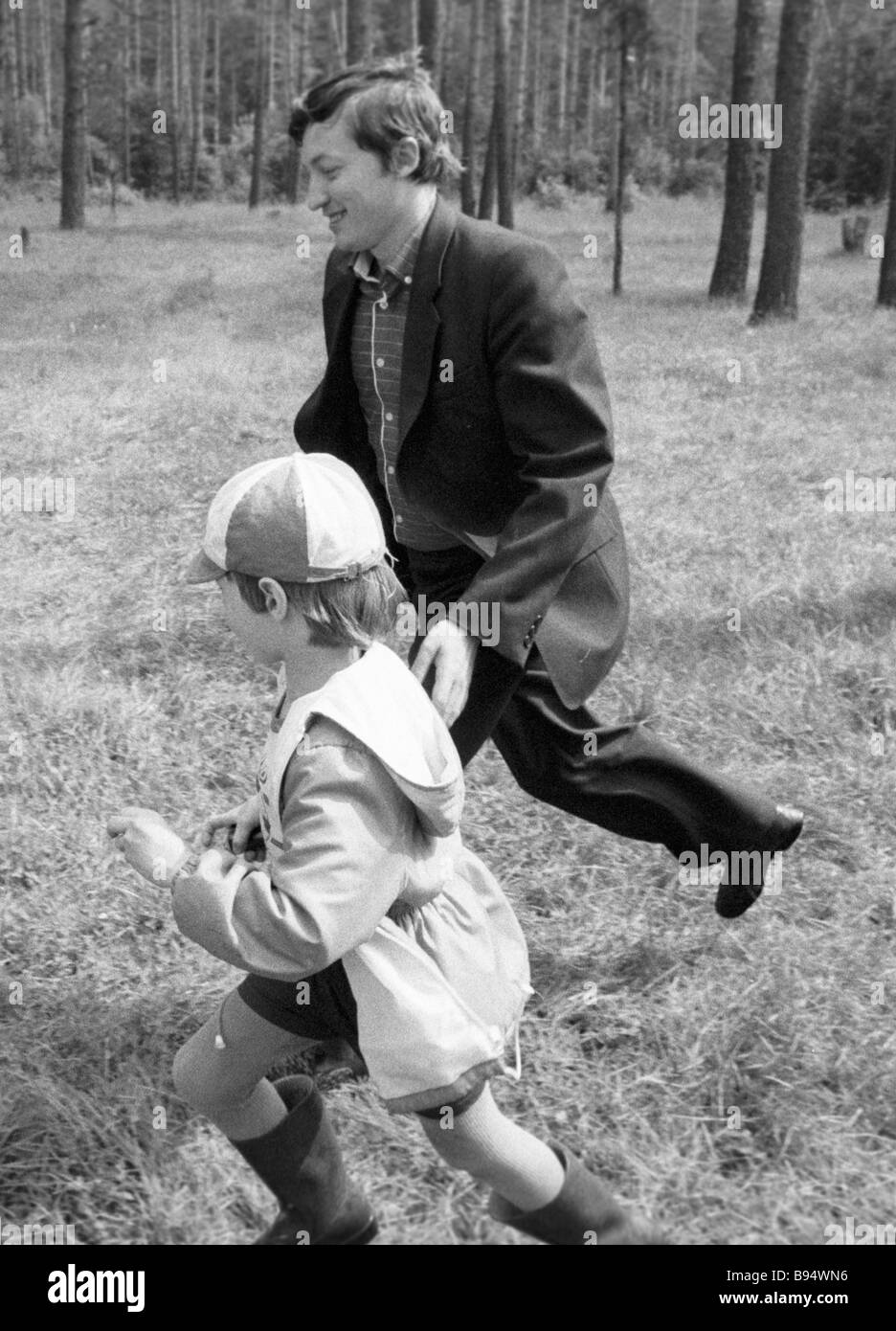 World chess champion Anatoly Karpov right with son at a walk Stock