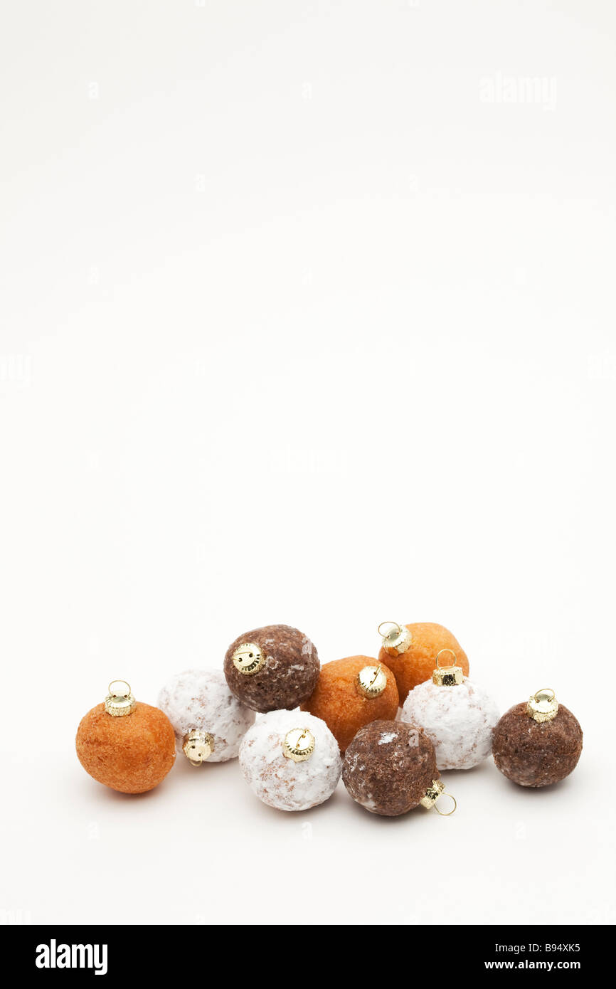 Nine donut holes with Christmas ornament tops Stock Photo