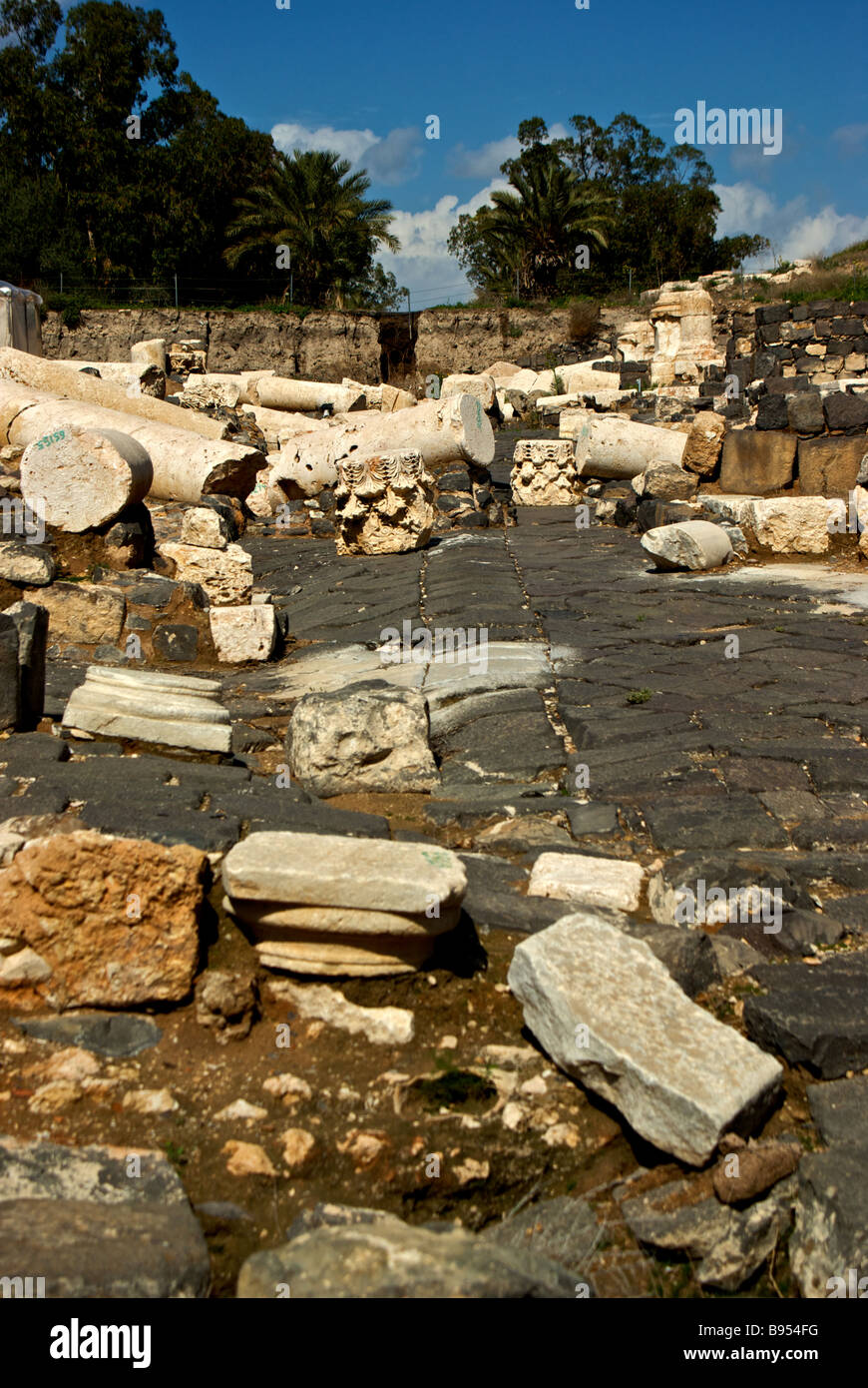 Earthquake toppled building debris ruins and upheaved stone floors in archaeological excavation site at Bet She an Stock Photo