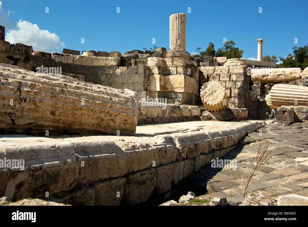 Earthquake strewn building columns debris ruins and upheaved floors in archaeological excavation site at Bet She an Stock Photo