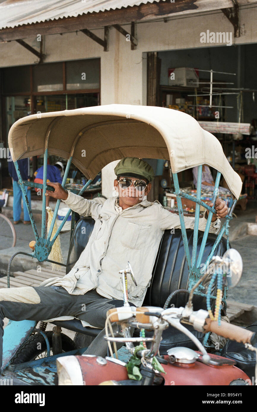 Ricksha waiting for passengers Vientiane Stock Photo - Alamy
