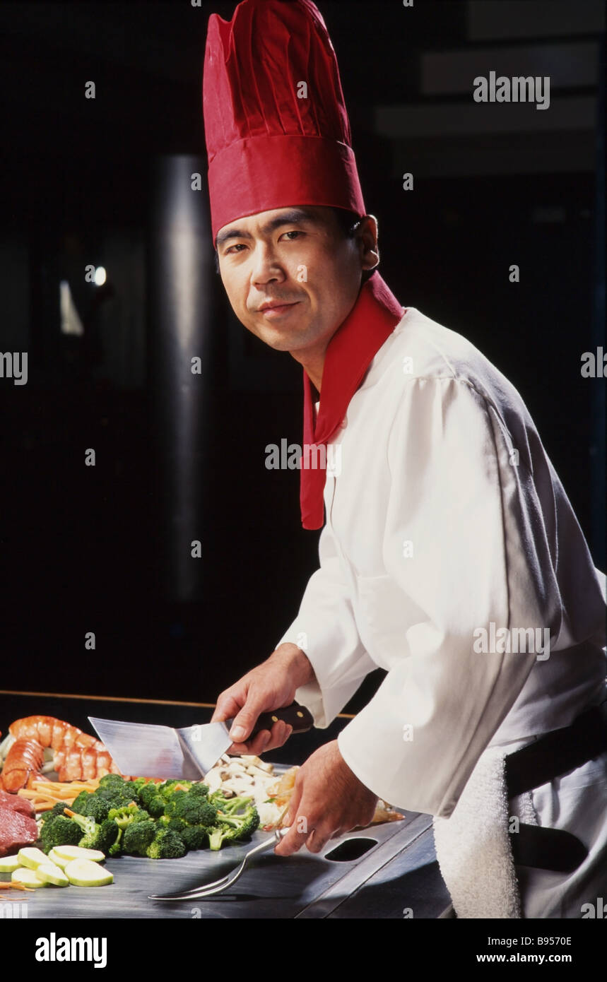 Food Display, gourmet resturant, Japanese chef preparing food at grill table Stock Photo